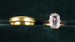 A 22 Carat Gold Wedding Band and A 9 Carat Gold Ring set with an  'emerald-cut' aquamarine and