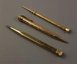 Three Gold Propelling Pencils: A 9 carat gold square shaft 'yard o led' pencil. An 'WHAL EVERSHARP