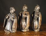 Three Unusual Elizabethan Three-quarter Length Figures carved from dark, richly patinated pine.  Two