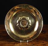 A 15th Century Nuremberg Brass Alms Dish with a cinqfoil boss centred by a flat roundel and punch-