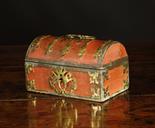 A 17th Century French Dome Topped Casket. The rectangular casket clad in scarlet fabric edged with