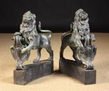 A Fine Pair of 19th Century Green Patinated Bronze Lions Rampant, cast in detail and poised with