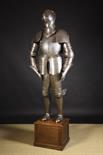 An Impressive 19th Century Copy of a 16th Century Full Suit of Armour engraved with panels of