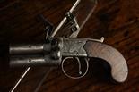 A Small Flintlock Box-Lock Over and Under Tap-Action Pocket Pistol by M. Cara Newbury .