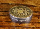 A Fine Early 19th Century Pill Box of oval form. The lid intricately inlaid in gold with a winged