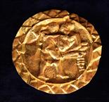 A Fine Gold Foil Roundel believed to be Roman, embossed with an Erotic scene in a zig-zagged border,