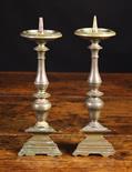 A Pair of Small Early 18th Century Bronze Pricket Sticks with knopped stems above triangular