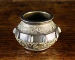 A Miniature 17th/18th Century Islamic Bronze Mortar of bulbous form, decorated with a band of script