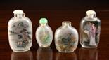 Four Chinese Reverse Painted Glass Snuff Bottles. One decorated with landscapes and signed, 3 ins (