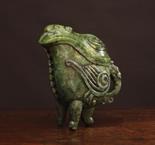 A Good Spinach Jade Guang-type Tripod Wine Vessel of archaic form. The shaped lidded vessel with