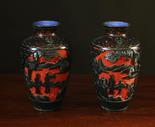 A Pair of Unusual Antique Chinese Vases with cobalt blue enameled interior and a black lacquered