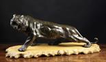 A Fine Oriental Bronze Study of a Prowling Tiger of dark brown patination with golden brown