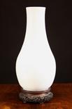 A 19th Century Pale Grey Celadon Vase mounted on a pierced and carved hardwood stand, 16½ ins (42