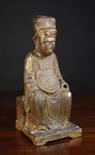 An 18th Century Gilded and Polychromed Wooden Carving of a Seated Chinese Emperor, 22 ins (56 cms)