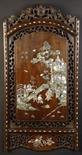 A Chinese Mother-of-Pearl Inlaid Zitan Panel. The arched panel depicting a dignitary and