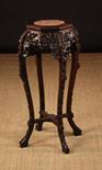 A 19th Century Chinese Carved Hardwood Plant Stand.  The octagonal top having a pink marble insert