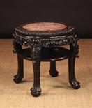 A Large 19th Century Chinese Carved Hardwood Table/Plant Stand.  The petalled top having a pink