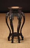 A 19th Century Chinese Carved Hardwood Plant Stand.  The hexagonal top having a pink marble insert