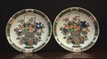 A Pair of Late 19th Century Famille Verte Dishes (one A/F). The centre panels decorated with baskets