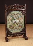 A Chinese Carved Hardwood Screen with replaced Wool-work Panel. The glazed panel depicting a