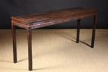 An Antique Chinese Rosewood Altar Table.  The long rectangular top above decorative frieze rails