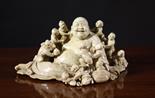 A Fine 19th Century Soapstone Group Carving of Jovial Buddah surrounded by nine Buddhistic