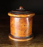 A 19th Century Turned Lignum Vitae String Pot. The moulded slightly domed lid pierced with string