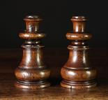 A Pair of Treen Candlesticks of turned oak, 6¾ ins (17 cms) in height.