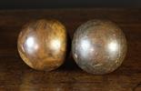 Two Antique Lignum Bowling Balls, 4 ins (10 cms) in diameter.