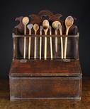 A Late 18th/Early 19th Century Boarded Spoon Rack. The planked back having a single rail pierced