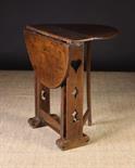 A Small 18th Century Joined Oak Drop Leaf Table.  The oval top on end plank supports pierced with