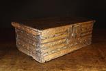 A Small 17th Century Oak Box.  The front and side boards decorated with chip carved channel moulding