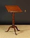 A George III Mahogany Tripod Reading/Writing Table.  The square tilting top with rounded corners,