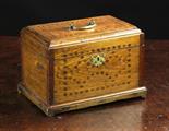 An 18th Century Oak Box inlaid with mahogany dowels and having a brass swing handle to the lid and a