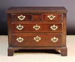 A Small, Low 18th Century Oak Chest of Drawers. The two short and two long drawer with lip-moulded