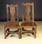 A Similar Pair of 18th Century Joined Oak Side Chairs.  The shaped top rails above a broad centre