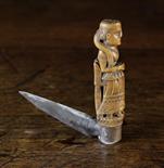 A Small 18th Century Folding Pen Knife with a steel blade and carved handle in the form of a