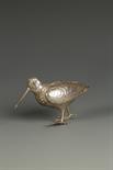 A GERMAN TABLE ORNAMENT modelled in the form of a snipe, with hinged wings and detachable head, by