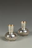 A PAIR OF LATE VICTORIAN VASES with cylindrical collars, and circular bodies, part fluted