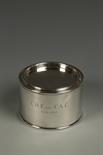 A CANISTER AND COVER of circular form, engraved with a presentation inscription, the underside with