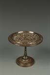 A VICTORIAN ELECTROPLATED TAZZA, decorated in the classical manner with cherubs amongst scrollwork,