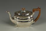A LATE VICTORIAN TEAPOT of shaped oval form, with an angular handle, makers mark rubbed, London