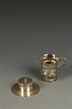 A GEORGE IV CHRISTENING MUG of baluster form, with serpent handle and embossed body, engraved with