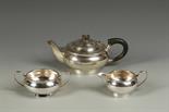 A THREE PIECE TEA SET of circular bellied form, with scroll handles on a tucked in foot, by Walker