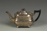 A TEAPOT of rectangular form with a moulded girdle, a scroll handle, on ball feet, by William