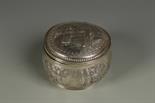 A DUTCH BOX of circular bellied form, the hinged cover with embossed vignette, the body decorated
