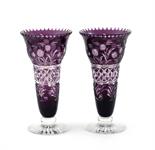 A pair of Webb purple overlay flash cut vases, cut with stylised flowers and geometric panels, on
