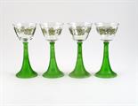 A set of four Theresienthal hock glasses, the ribbed green bowls supporting clear, faceted bowl