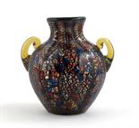 A Stevens & Williams glass vase, ovoid with everted rim and applied handles, aubergine glass with