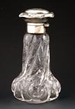 A Stevens & Williams faux rock crystal bottle with silver cover, body with cut flower decoration,